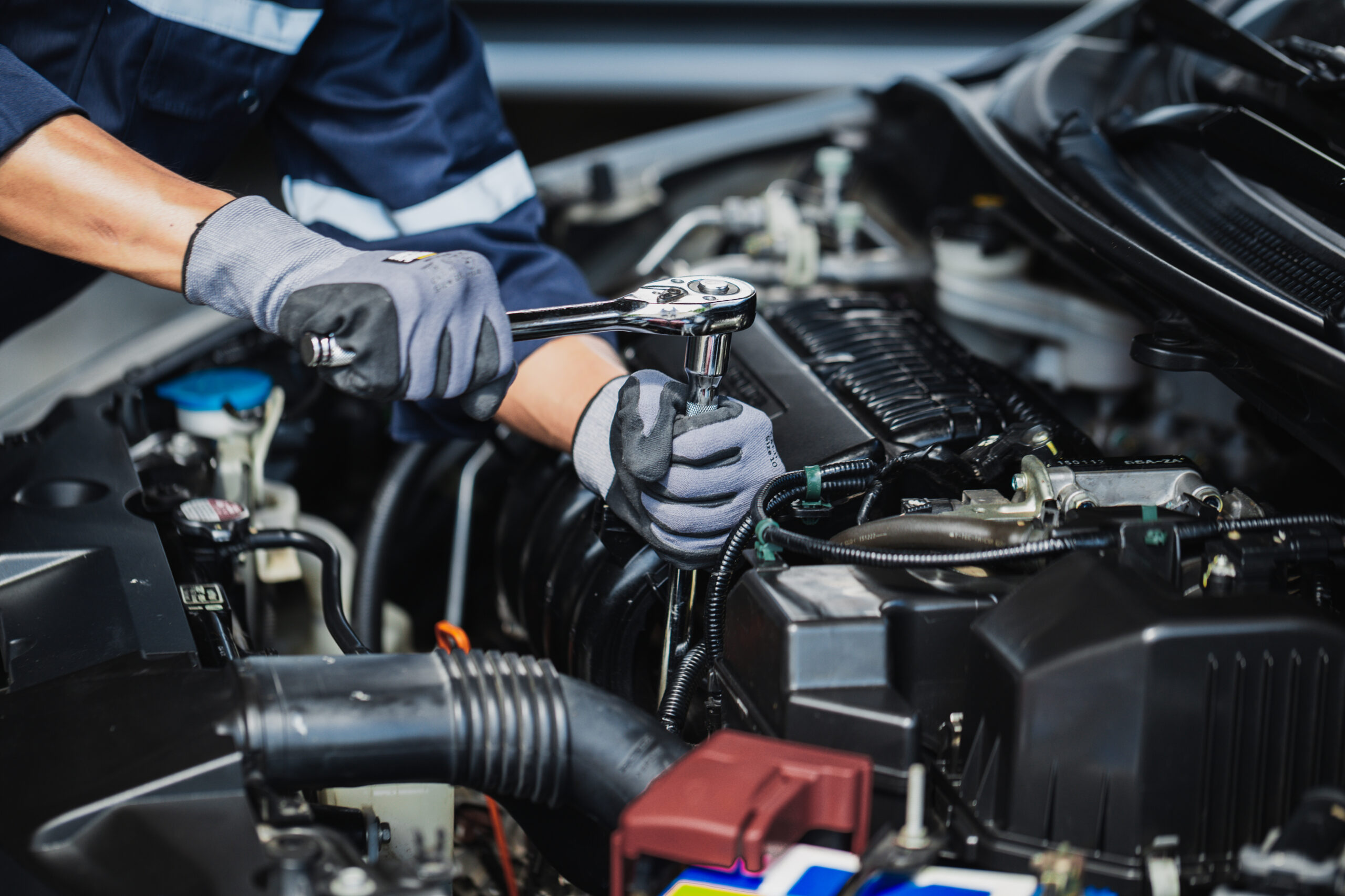 Technician working on a vehicle in the shop