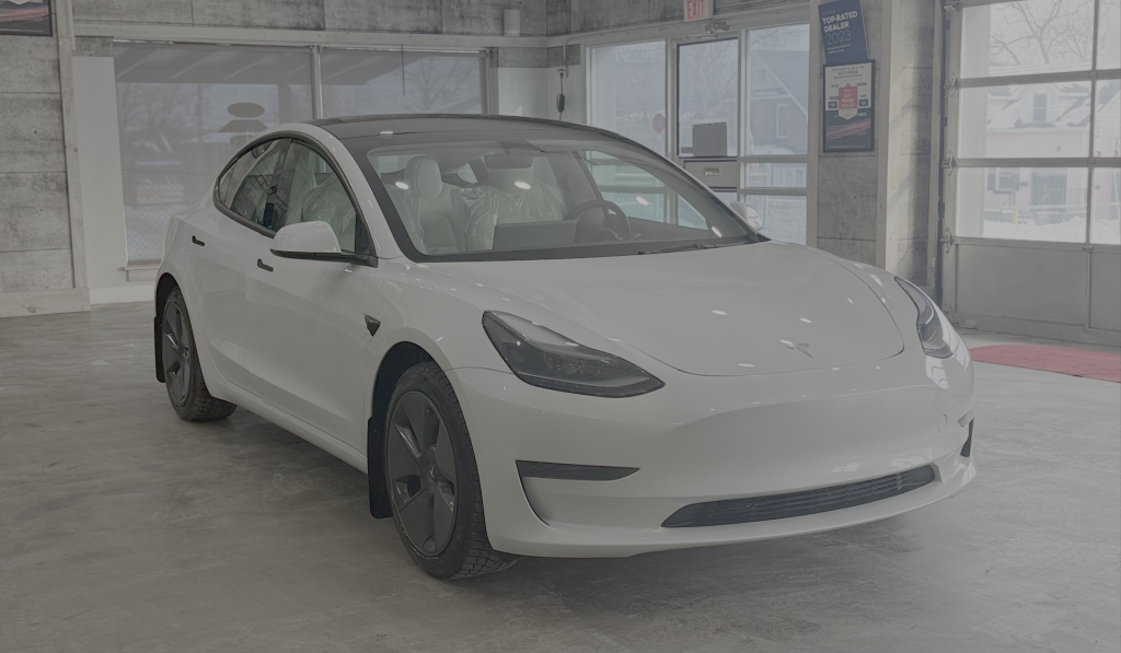 Used Tesla Model 3 electric car at Planet Motors dealership in Canada