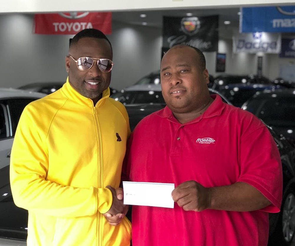 happy customer receiving check from referral program
