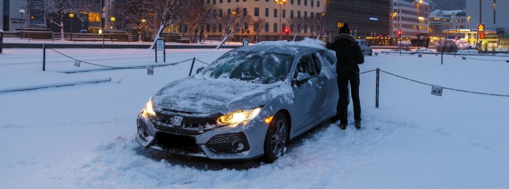 Honda Civic covered in snow