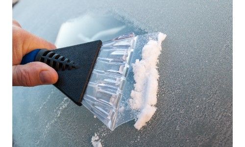 Ice scraper scraping off ice