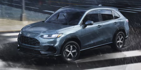 Honda driving in the rain