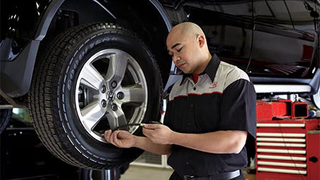 Technician changing tires
