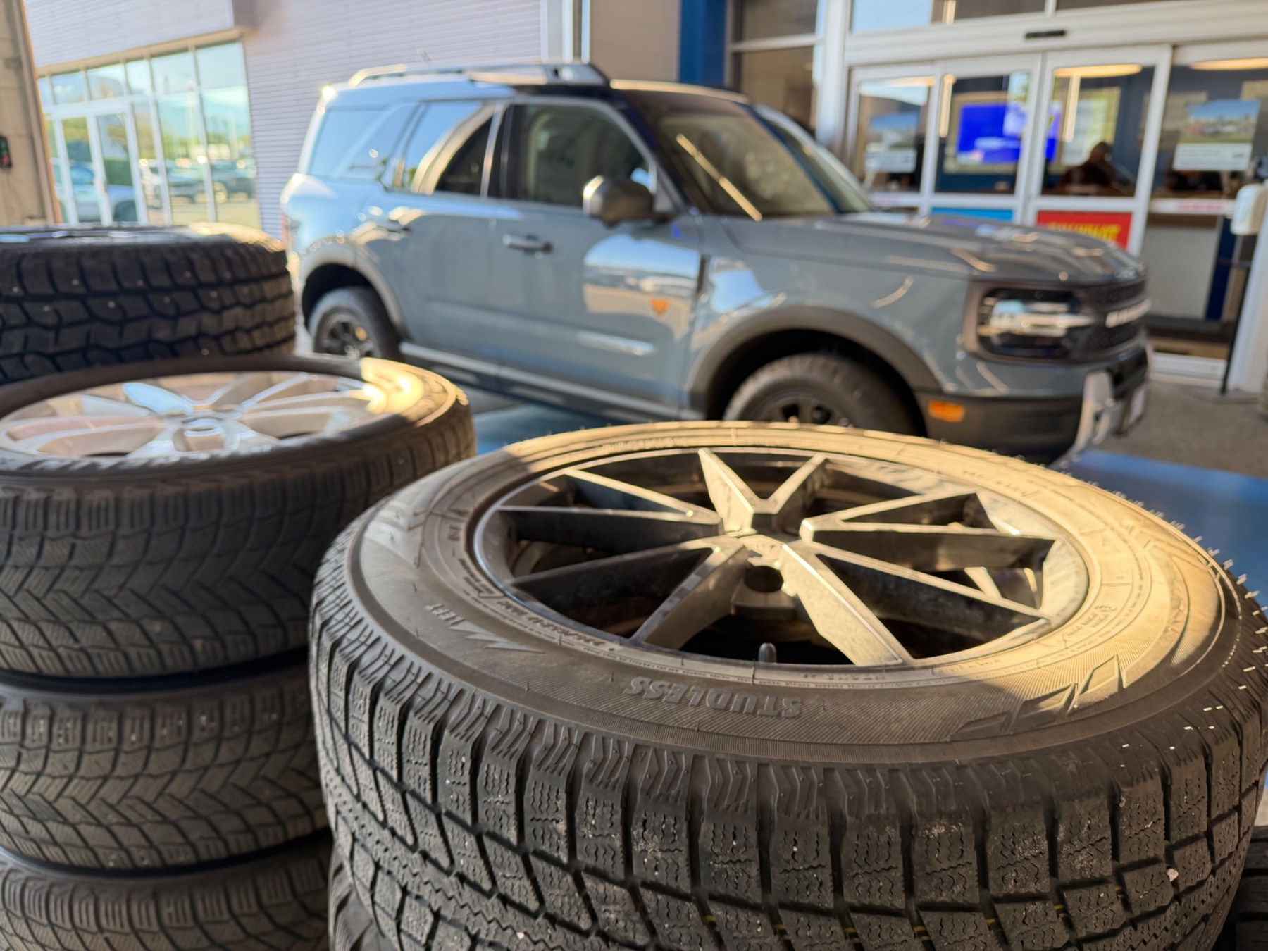 Winter tire changeover underway in the service bay at Watkin Motors Ford in Vernon BC