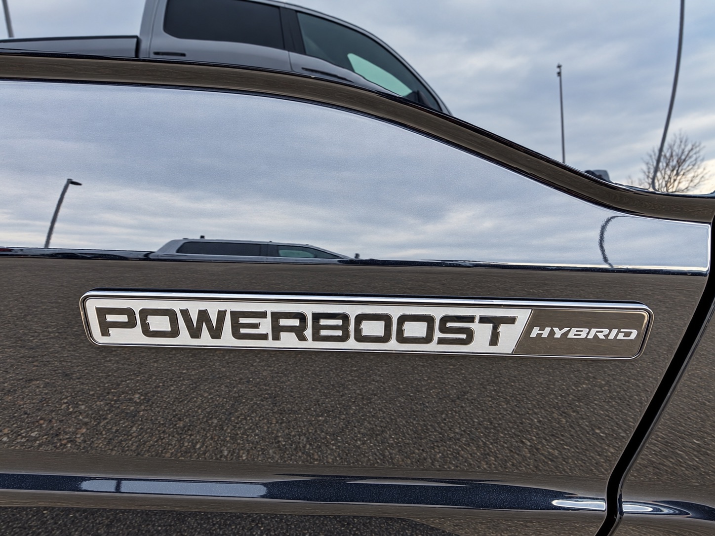 PowerBoost Hybrid badge on the side of a Ford F-150