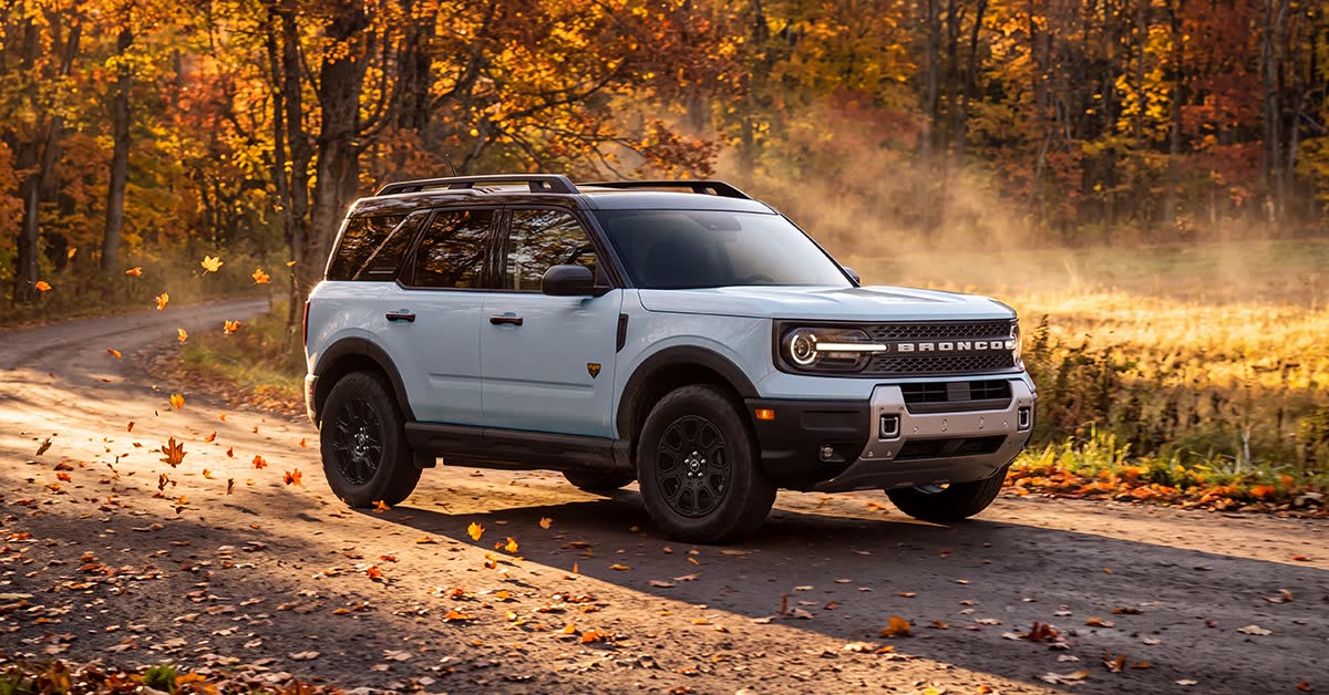2026 Ford Bronco Sport on a gravel road through fall forest