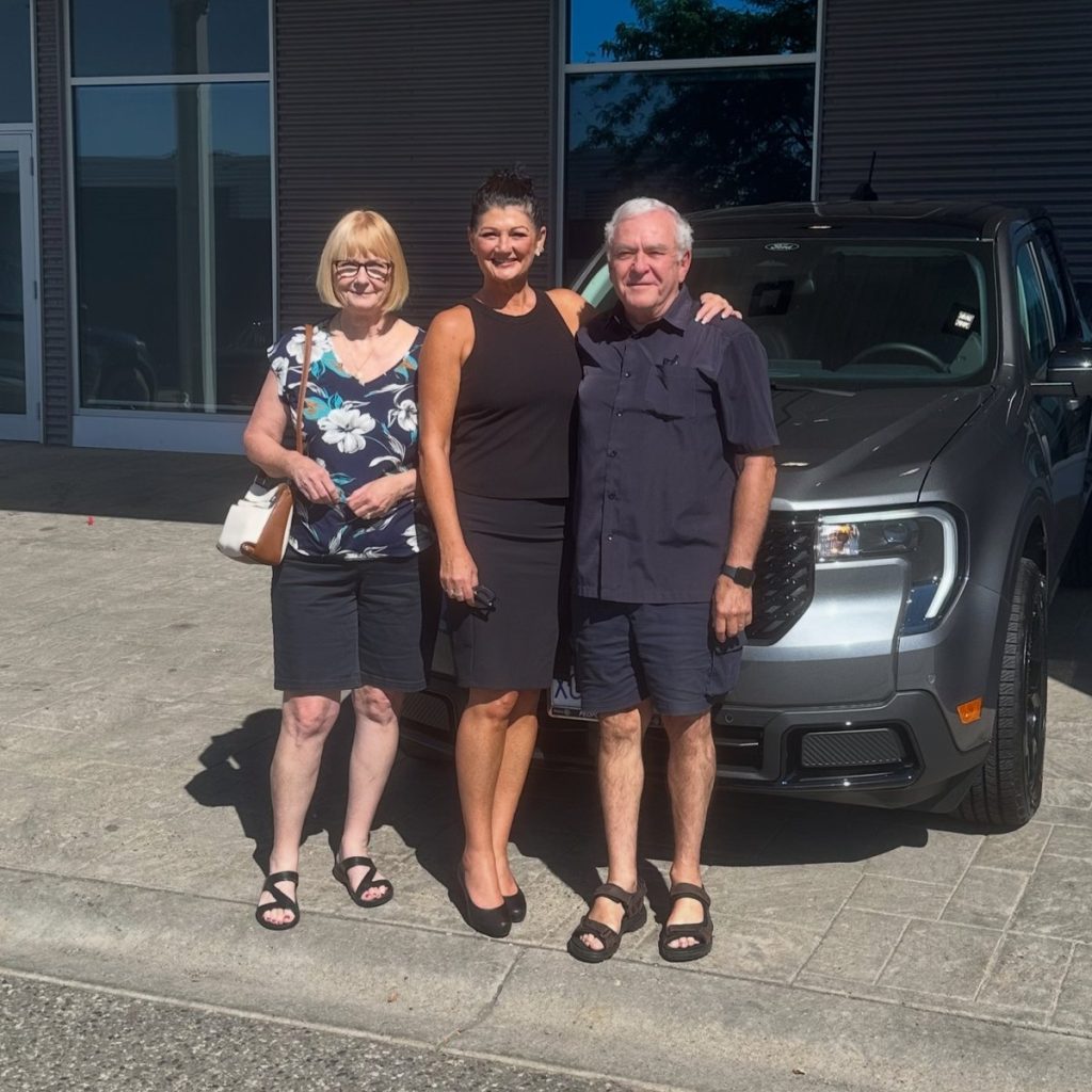 Happy new Ford owners on delivery day at Watkin Motors Ford in Vernon