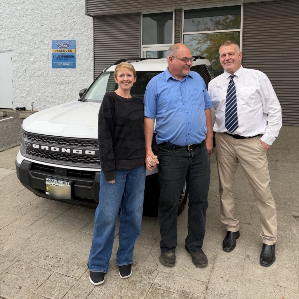 New Ford owners with their Watkin Motors salesperson in Vernon, BC