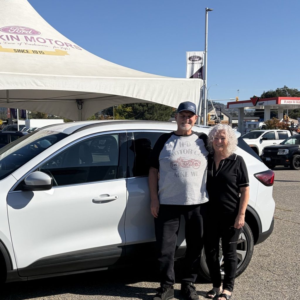 New Ford owners celebrating delivery day in Vernon