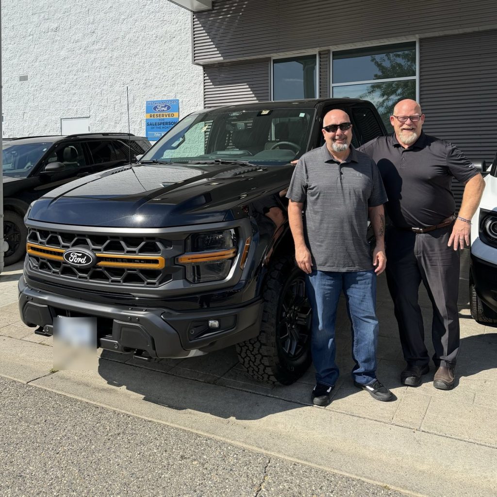 Customer and Watkin Motors team with a new Ford pickup in Vernon