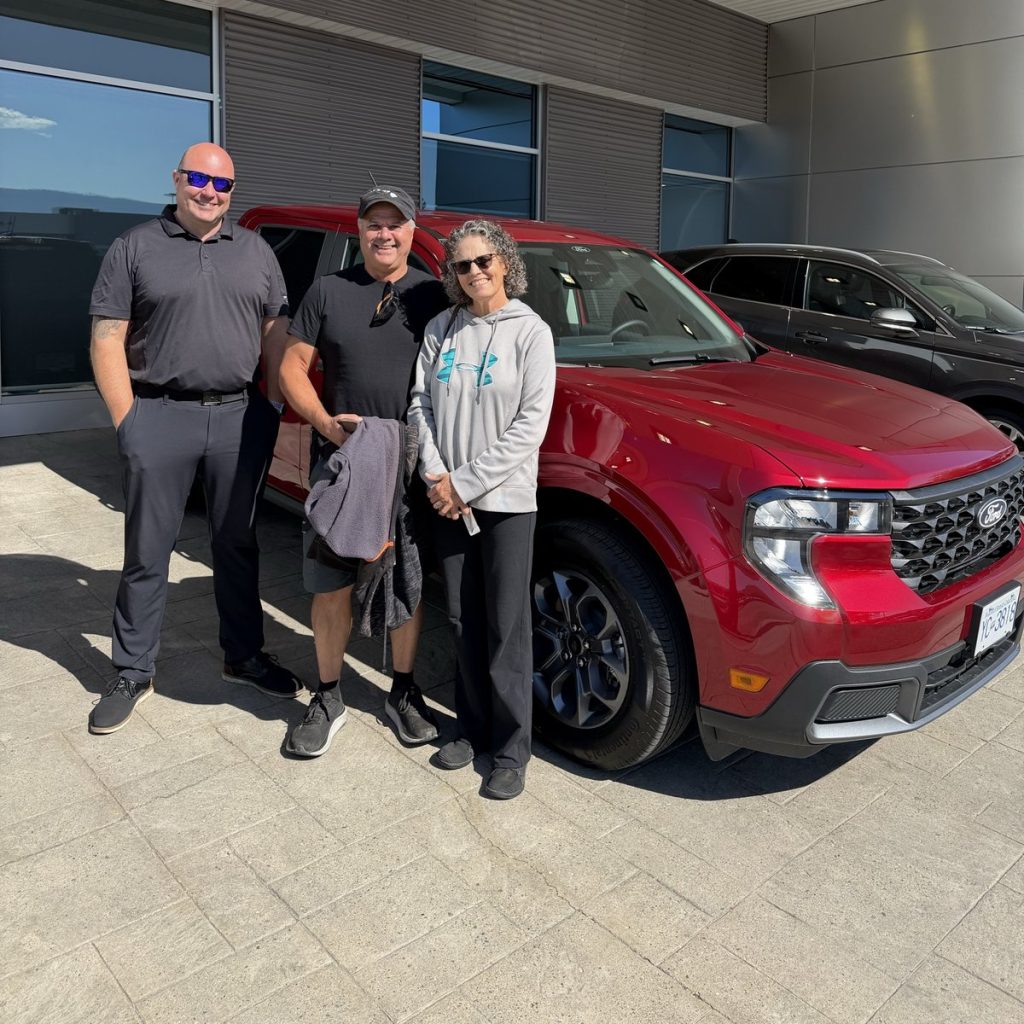 New Ford owners with their vehicle outside Watkin Motors Ford