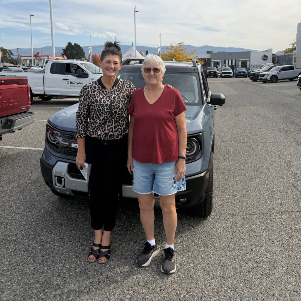 Two happy customers with their new Ford at Watkin Motors Ford