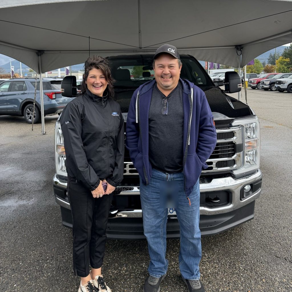 Happy customers with a new Ford Super Duty at Watkin Motors