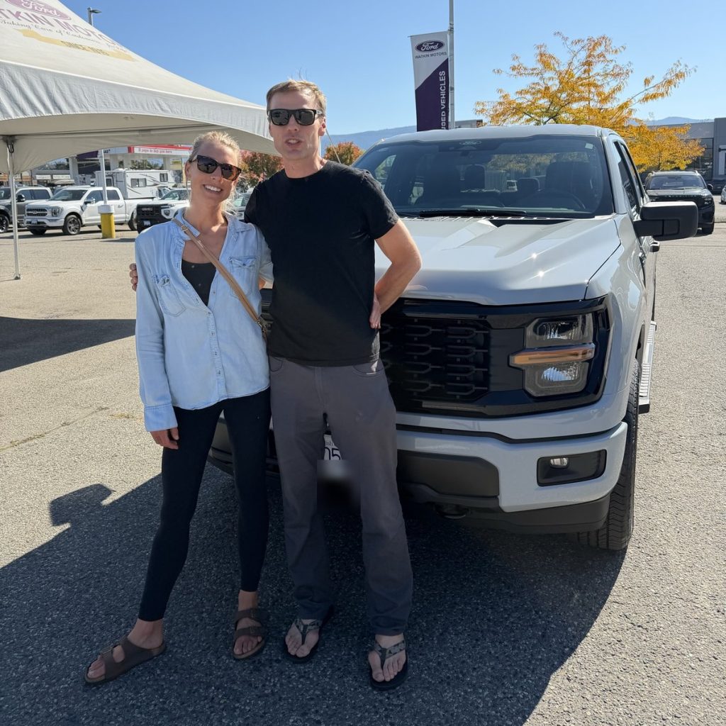 Happy couple with their new Ford pickup at Watkin Motors in Vernon