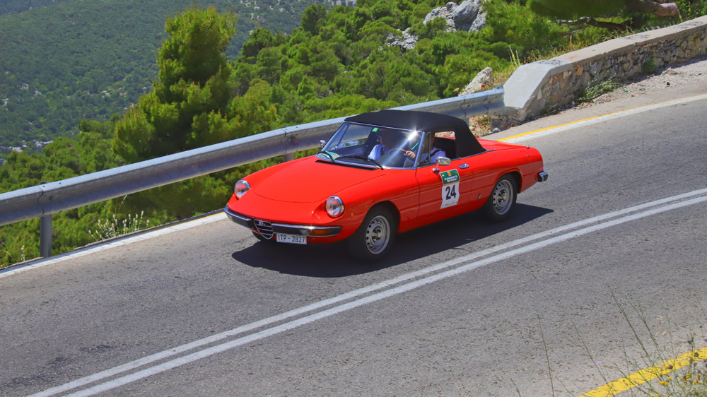 red Alfa Romeo Spider on Road