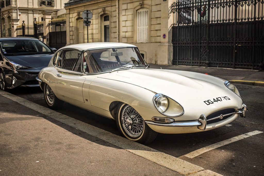white Jaguar e-type parked in London