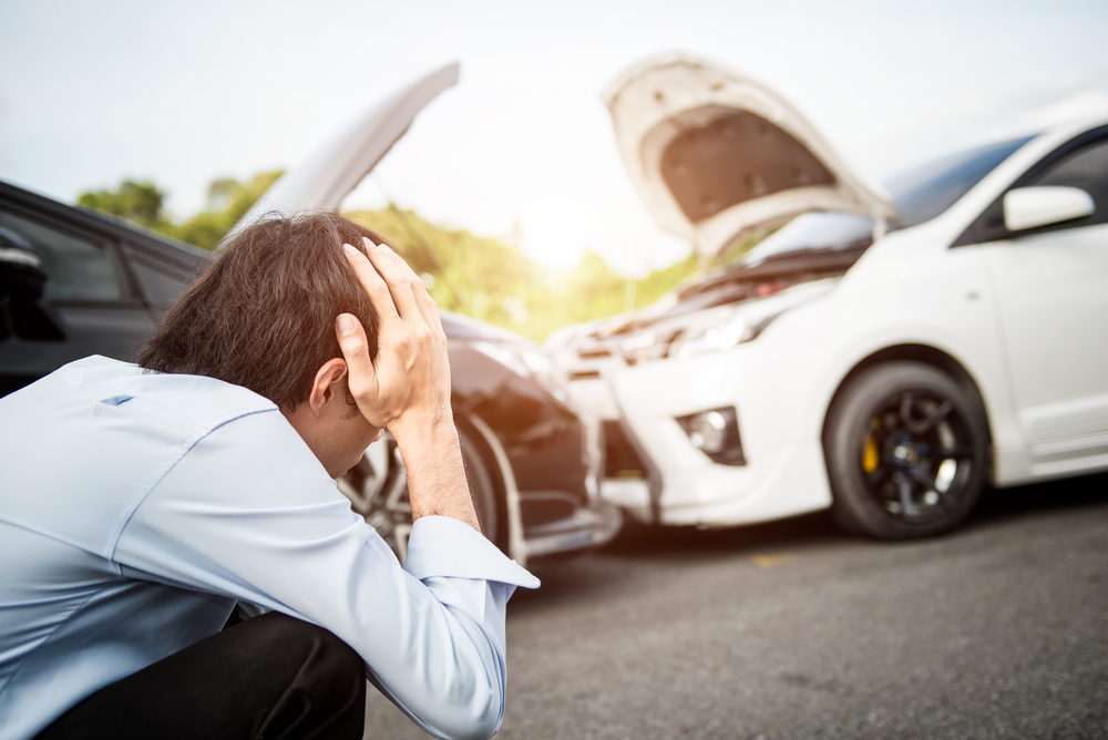 man after car crash