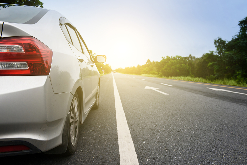 close up of grey car on road