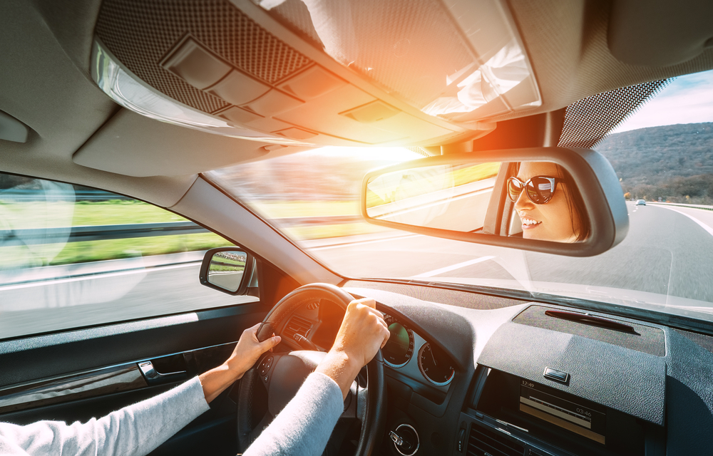 woman test driving a used car