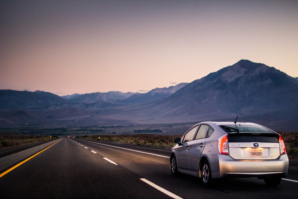 New Toyota driving on empty road