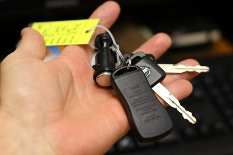 person holding keys after financing car